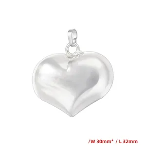 Detailed view of silver heart pendant measuring 30mm by 32mm with secure metal clasp
