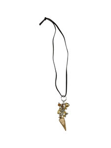 Detail of bohemian ivory necklace with black leather cord and golden heart charms