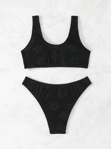 Chic black two-piece bikini set with textured floral fabric and U-neck swim top