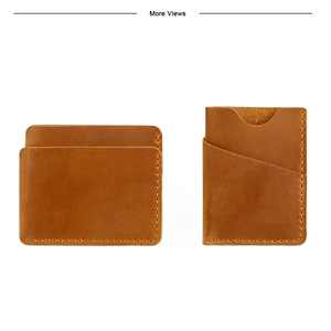 Detail view of vintage tan crazy horse leather card holder with yellow stitching