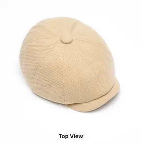 Top view of beige wool blend newsboy cap showing eight-panel stitch and button detail