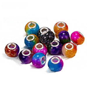Macro detail of colorful large hole beads with gradient cracks and silver metal inner rings