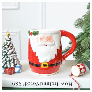 Detailed view of 3D Santa Claus ceramic mug with festive holiday decorations and glossy finish