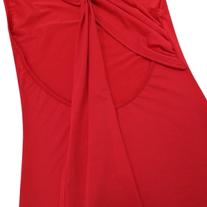Detail of red ruched fabric texture and stitching on an elegant backless long dress