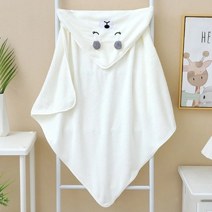 Close-up of white hooded baby towel with bear embroidery and plush 3D ears