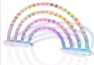 Rainbow acrylic earring display stand with cloud bases showing organized jewelry holes