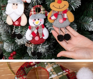 Macro detail of plush Santa and reindeer ornaments with plaid fabric and beads