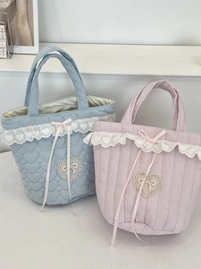 Cute quilted bucket bags with lace trim and heart appliqués in pink and blue colors