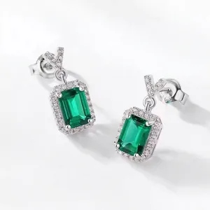 Detailed shot of emerald cut green earrings with S925 silver studs and micro-pave crystals