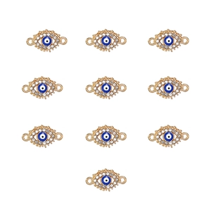 Detailed view of ten gold-plated evil eye connectors with blue stones and clear crystals