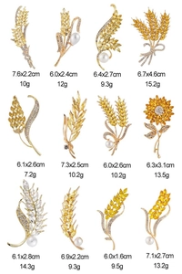 Detailed grid of 12 crystal wheat and floral brooches with dimensions and weight data