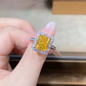 Macro detail of radiant yellow ice-cut cubic zirconia ring with S925 silver double halo