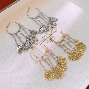 Metallic fishtail pearl tassel drop earrings in gold and silver finish with charms
