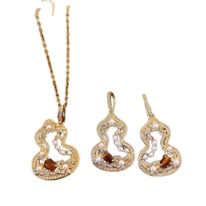 Parure bijoux dorée avec oeil de tigre, perle et zircon au design de gourde évidée