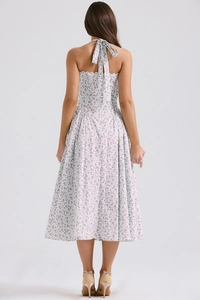 Detail of the backless halter neck strap and purple floral print on the midi dress