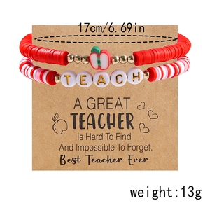 Detail of Teacher appreciation bracelets with red clay beads and TEACH letter beads on a card