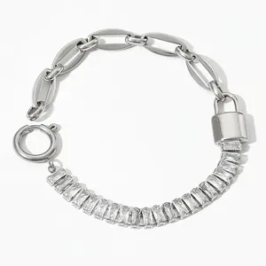 Detail of stainless steel chain bracelet featuring a padlock charm and zircon stones