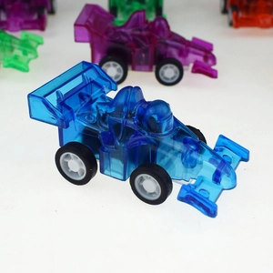 Macro shot of colorful transparent plastic F1 racing cars with smooth black rubber tires