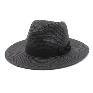 Detailed view of the fine-knit black straw fedora hat with a matching grosgrain ribbon