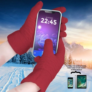 Detail of red knitted winter gloves with touch screen fingertips for phone use