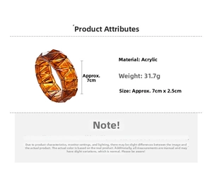 Detailed specs of amber acrylic geometric bangle showing 7cm diameter and 31.7g weight
