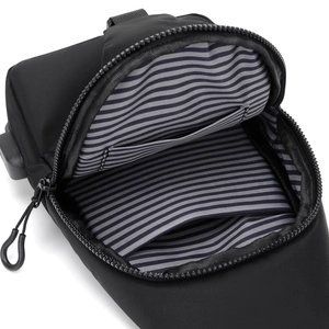 Minimalist black sling chest bag with striped lining and internal zipper storage