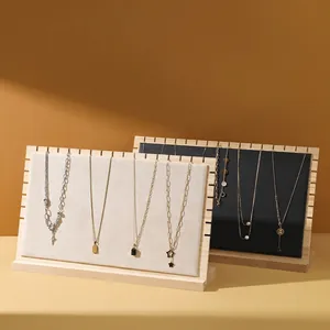 L-shaped wooden necklace display stand set with beige fabric and black leather panels