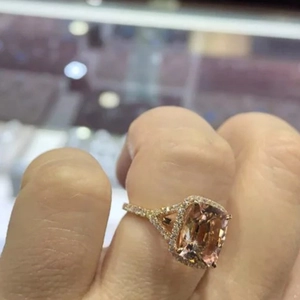 Rose gold engagement ring with a large cushion cut champagne zircon and pave setting diamonds