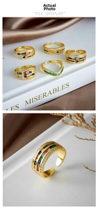 Detail of adjustable 18K gold plated rings with colorful rainbow cubic zirconia stones
