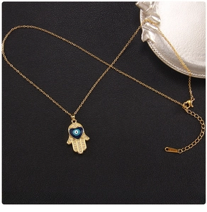 Detailed view of Hamsa Hand and heart Evil Eye pendant on a gold titanium steel chain