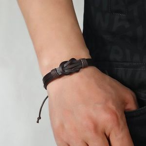 Men's vintage dark brown braided leather bracelet with adjustable knot design
