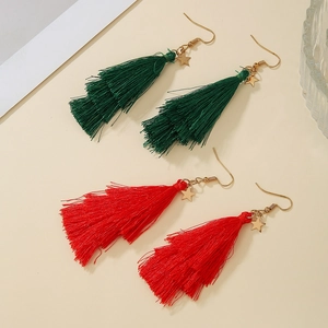 Detail of red and green layered tassel earrings with golden star charms and ear hooks