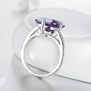 Luxury S925 silver ring featuring a large oval purple gemstone and pave diamond accents