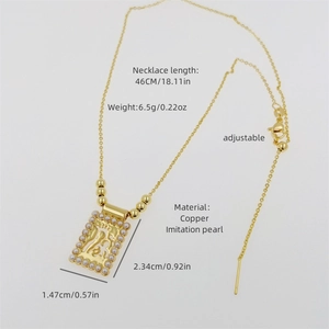 Detail of 18K gold plated necklace with Allah pendant and imitation pearl borders