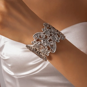 Detail of silver hollow floral wide open bangle with vintage baroque engraved patterns