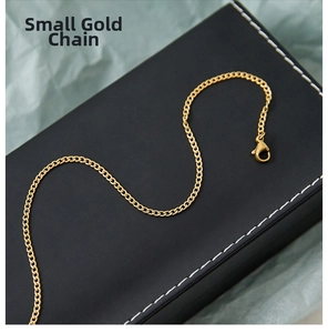 Detailed view of a gold-plated curb chain necklace featuring a secure lobster clasp