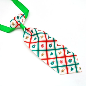 Christmas pet necktie featuring gingerbread man and snowflake patterns on red fabric