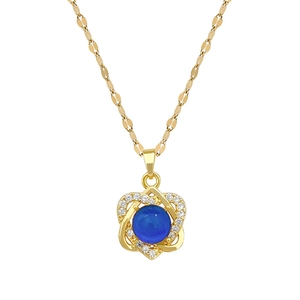 Elegant gold necklace with circular blue sapphire pendant and sparkling diamond accents