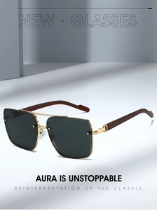 Detail of gold double-bridge sunglasses with dark lenses and reddish-brown wood grain temples
