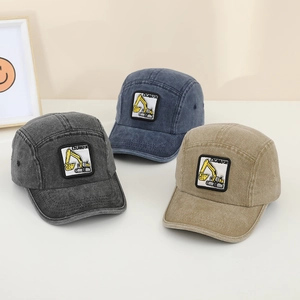 Detailed view of three kids' cotton denim baseball caps with excavator embroidery