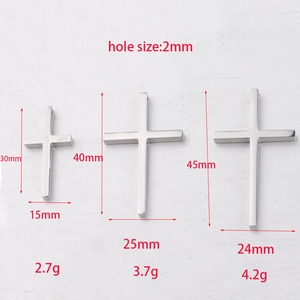 Size specifications for three mirror-polished stainless steel cross pendants with dimensions