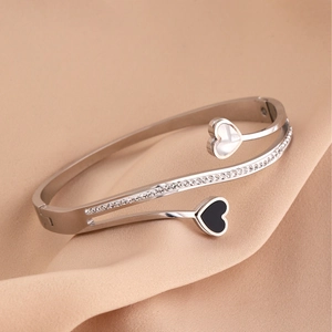 Elegant titanium steel heart bracelet with shimmering zircons and shell inlay detail
