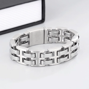 Close-up of polished silver stainless steel wide link chain bracelet for men