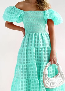 Detail of mint green off-shoulder dress featuring plaid jacquard texture and bubble sleeves