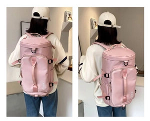 Pink multipurpose travel backpack with cylindrical barrel design and waterproof nylon detail