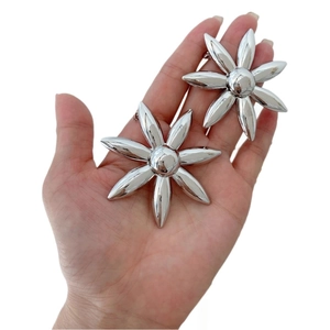 Chic oversized silver flower earrings for women with high-shine metallic finish