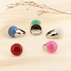 Morandi color enamel rings with marble texture and polished 18k gold band on silk fabric