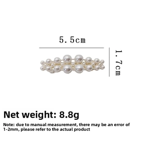 Detail view of double-row pearl hair clip in gold alloy with 5.5cm size measurement
