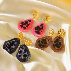 Fashionable teardrop leopard print earrings in pink, black, and brown with gold studs