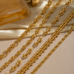 Five assorted gold plated chain necklaces including twisted heart and geometric links